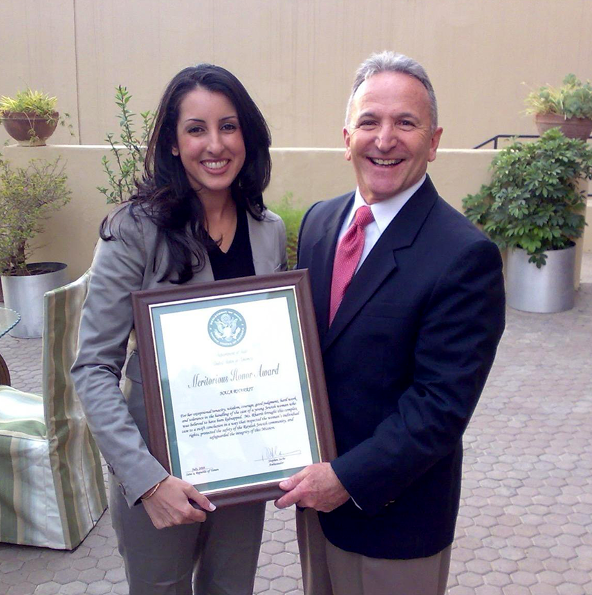 Hala Rharrit receiving a State Department Meritorious Honor Award in Yemen